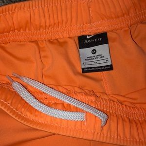 Orange Nike shorts